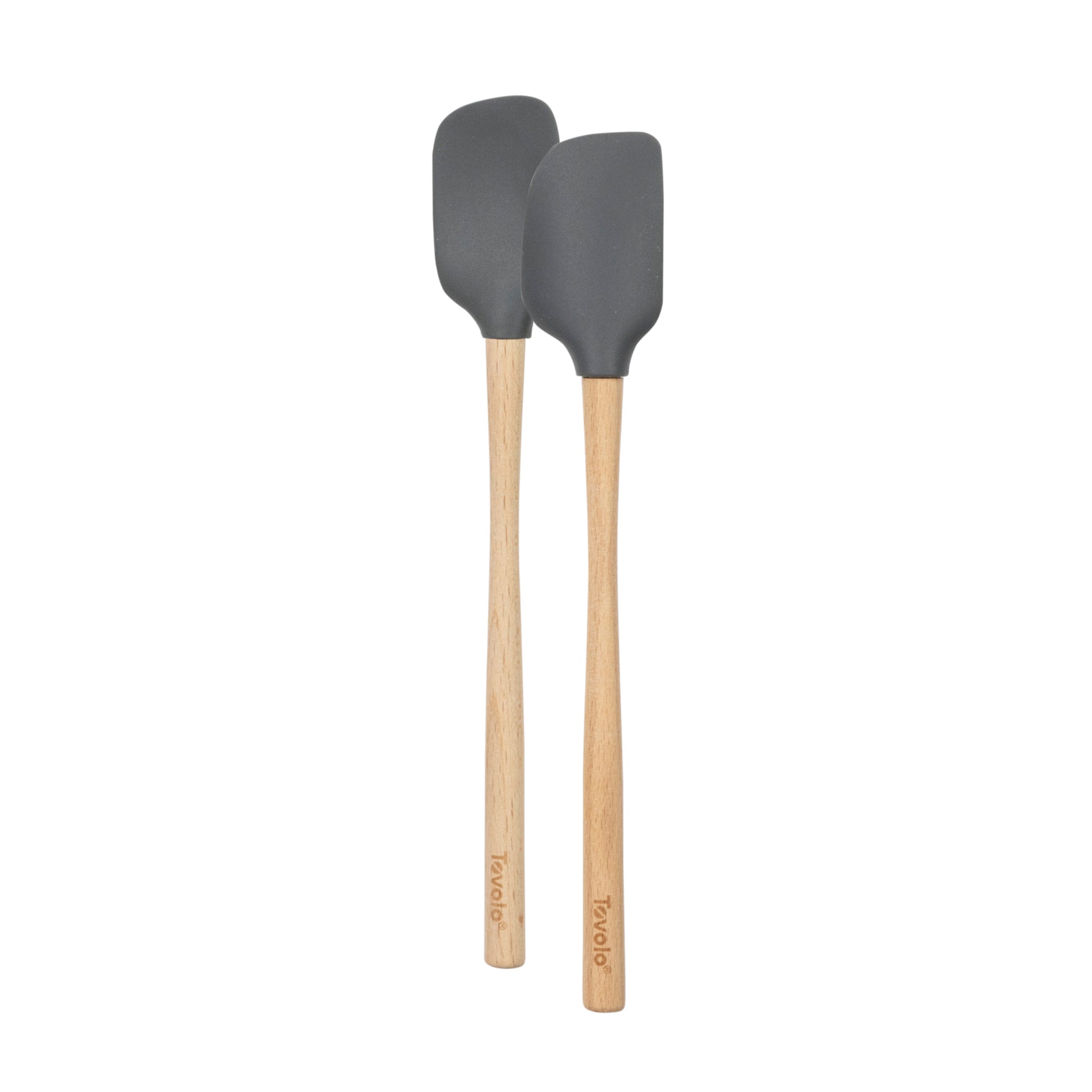 The tovolo Flex-Core Silicone Mini Spatula + Spoonula set, in gray with long wooden handles, is shown side by side on a white background—durable, heat-resistant tools ideal for mixing and stirring.