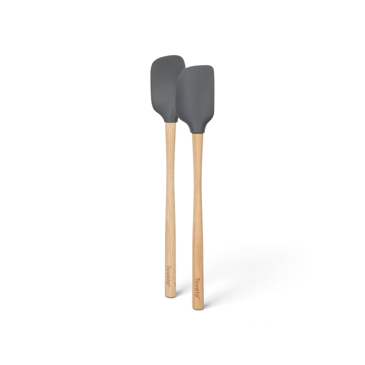 The tovolo Flex-Core Silicone Mini Spatula + Spoonula set, in gray with long wooden handles, is shown side by side on a white background—durable, heat-resistant tools ideal for mixing and stirring.