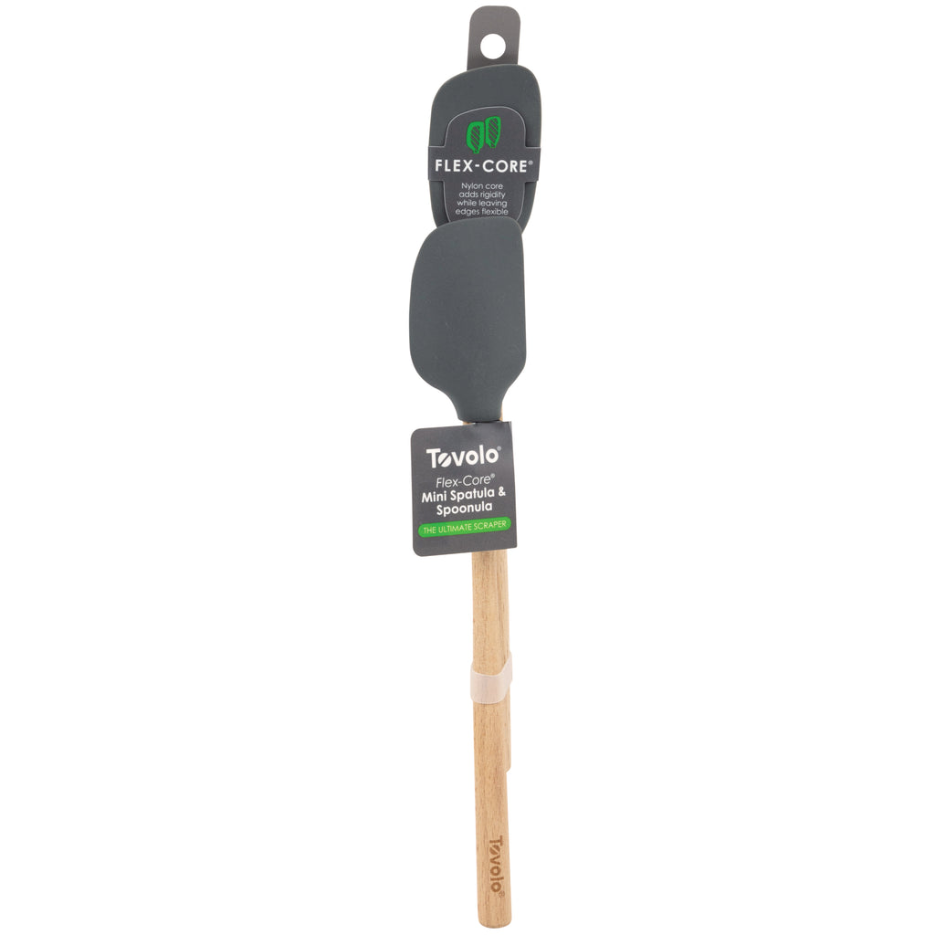 The tovolo Flex-Core Silicone Mini Spatula + Spoonula set features black silicone heads and wooden handles, packaged together against a white background. Heat-resistant and perfect for daily cooking tasks.
