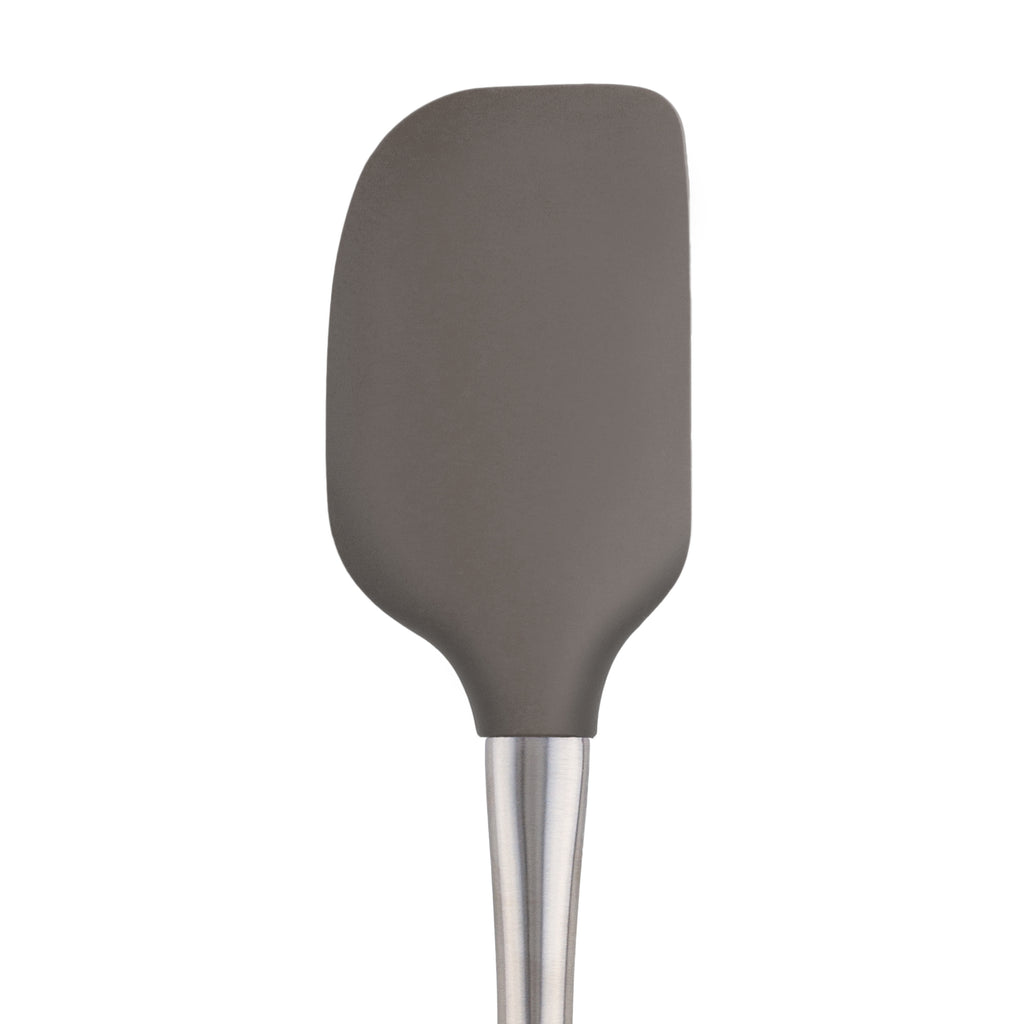 The Flex-Core Spatula, featuring a gray silicone head and stainless steel handle, is displayed against a white background.