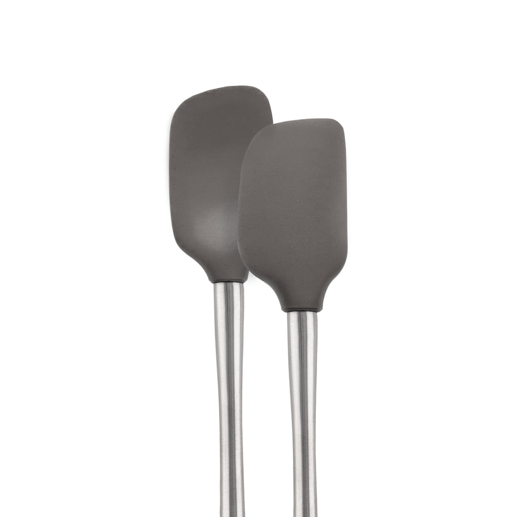 The tovolo Flex-Core Mini Spatula + Spoonula with Stainless Steel Handle in gray are side by side against a white background, featuring classic silicone designs ideal for mixing and scooping.