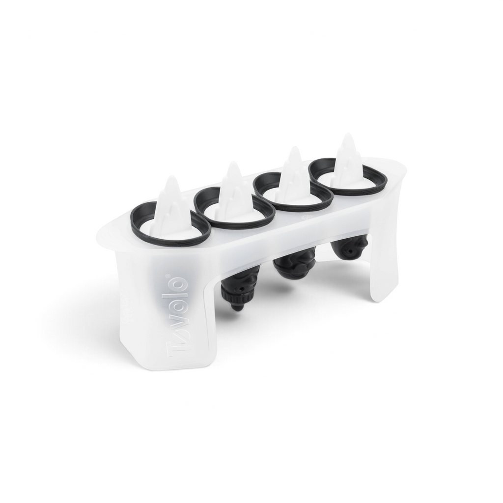 The Penguin Pop Molds is a white plastic tray with four slots, each featuring a black and white handle shaped like a penguin fin. Slim and perfect for homemade frozen treats, it has the Tovolo name embossed on the side.