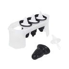 The Penguin Pop Molds set features a slimline tray holding four black and white molds shaped like penguins, with one mold removed and its white stick beside it—ideal for crafting homemade frozen treats.