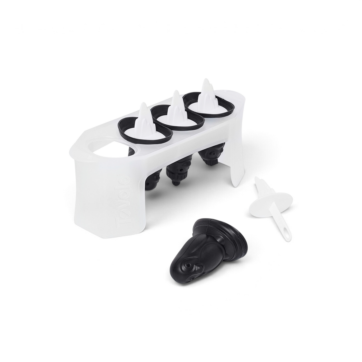 The Penguin Pop Molds set features a slimline tray holding four black and white molds shaped like penguins, with one mold removed and its white stick beside it—ideal for crafting homemade frozen treats.