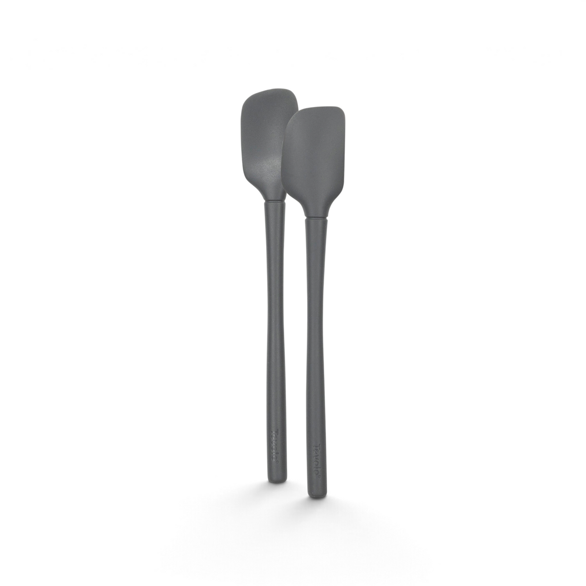 Two identical tovolo Flex-Core Silicone Mini Spatula + Spoonula utensils with long handles stand upright side by side against a white background, highlighting these heat-resistant kitchen tools.