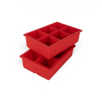 The tovolo King Cube Silicone Ice Molds (Set of 2) are red trays, each featuring six large square compartments, stacked slightly askew.