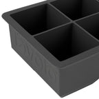 A close-up of the tovolo King Cube Silicone Ice Molds (Set of 2) in black, featuring four large square compartments and the brand name embossed on the side.