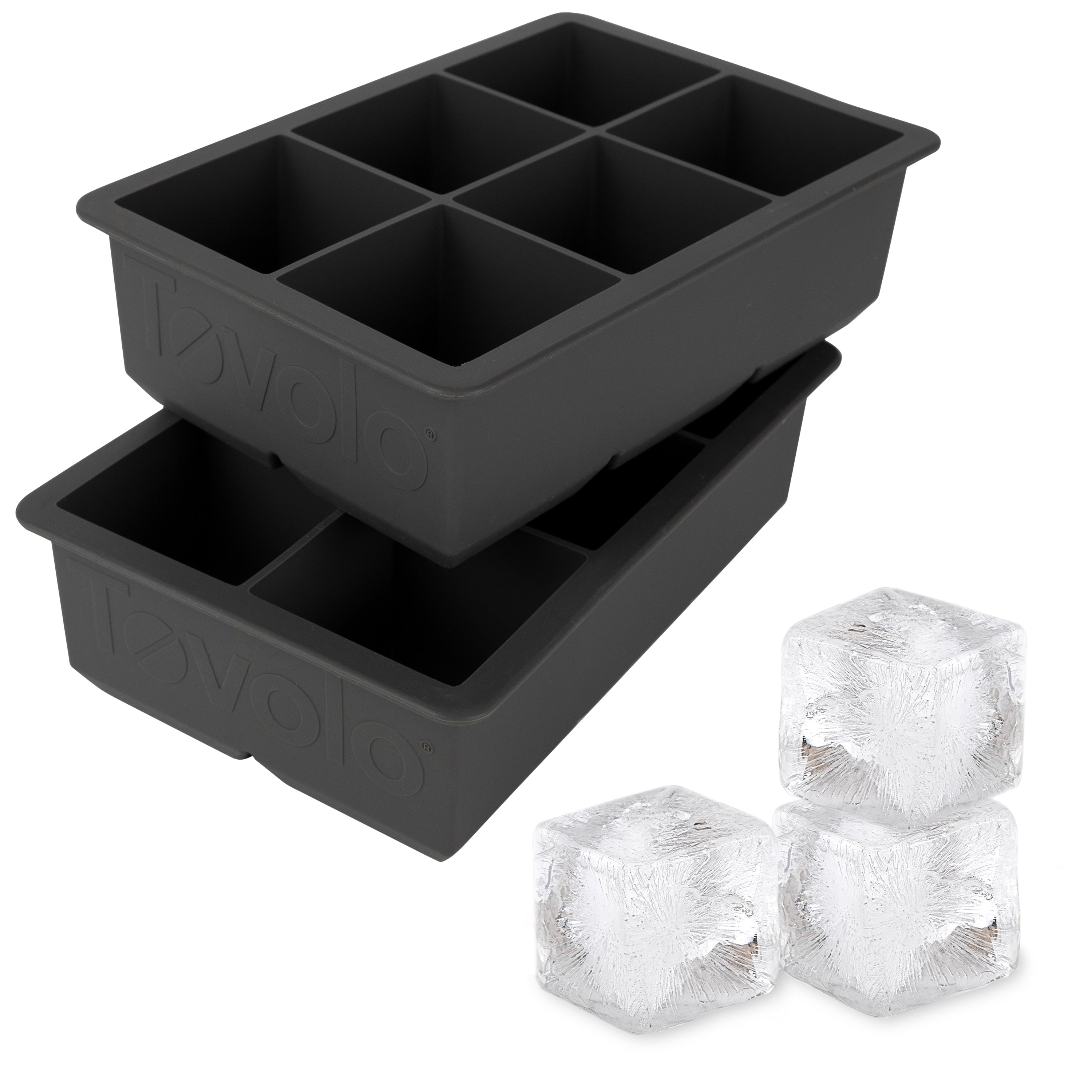 The tovolo King Cube Silicone Ice Molds (Set of 2) feature two black trays, each with six large square cavities—ideal for crafting impressive extra-large ice cubes at home.