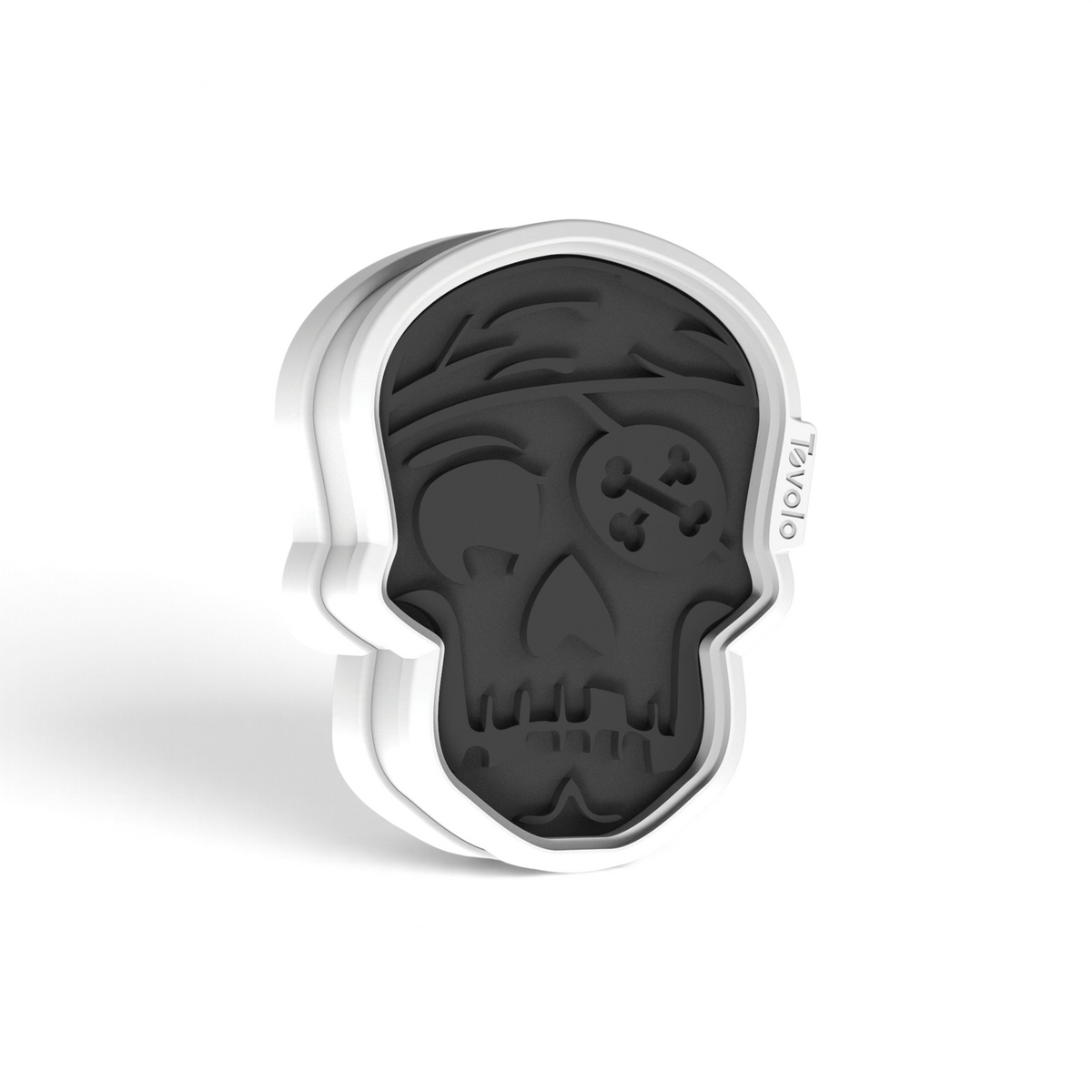 The Skull Cookie Cutters are black and white silicone molds shaped like pirate skulls, featuring a bandana, eye patch, and crossbones—perfect for making unique treats with your gingerbread or Christmas cookies. "TOVOLO" is printed on the side.