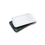 The rectangular Prep and Serve BBQ Tray, made of white textured plastic, sits atop a black metal baking sheet with raised edges, helping grill masters prevent contamination while preparing and serving food.