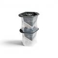 Two stacked tovolo Colossal Ice Molds (Set of 2) in clear and dark gray create large, geometric, slow-melting ice cubes. Each mold features the tovolo logo on the side.