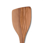 A close-up of Olivewood Utensils featuring a pancake turner with a smooth finish and unique wood grain patterns, nonstick safe and beautifully displayed against a white background.