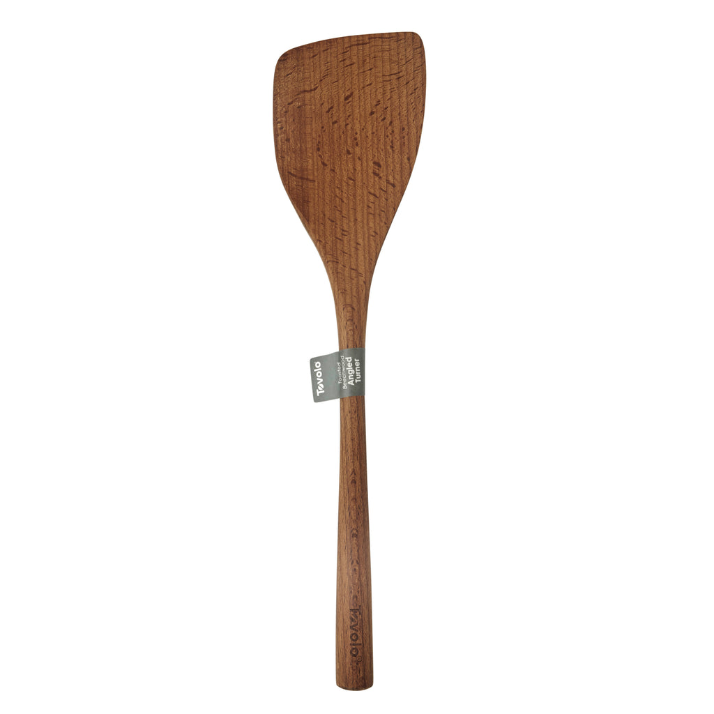 The Beechwood Utensils pancake turner features a flat, wide head and long handle, perfect for non-stick cookware. A small gray label around the neck highlights its smooth finish and visible wood grain.