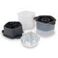 The tovolo Rose Ice Molds (Set of 2) are shown in black and white, with one mold creating a transparent rose-shaped ice cube using these detailed craft molds.