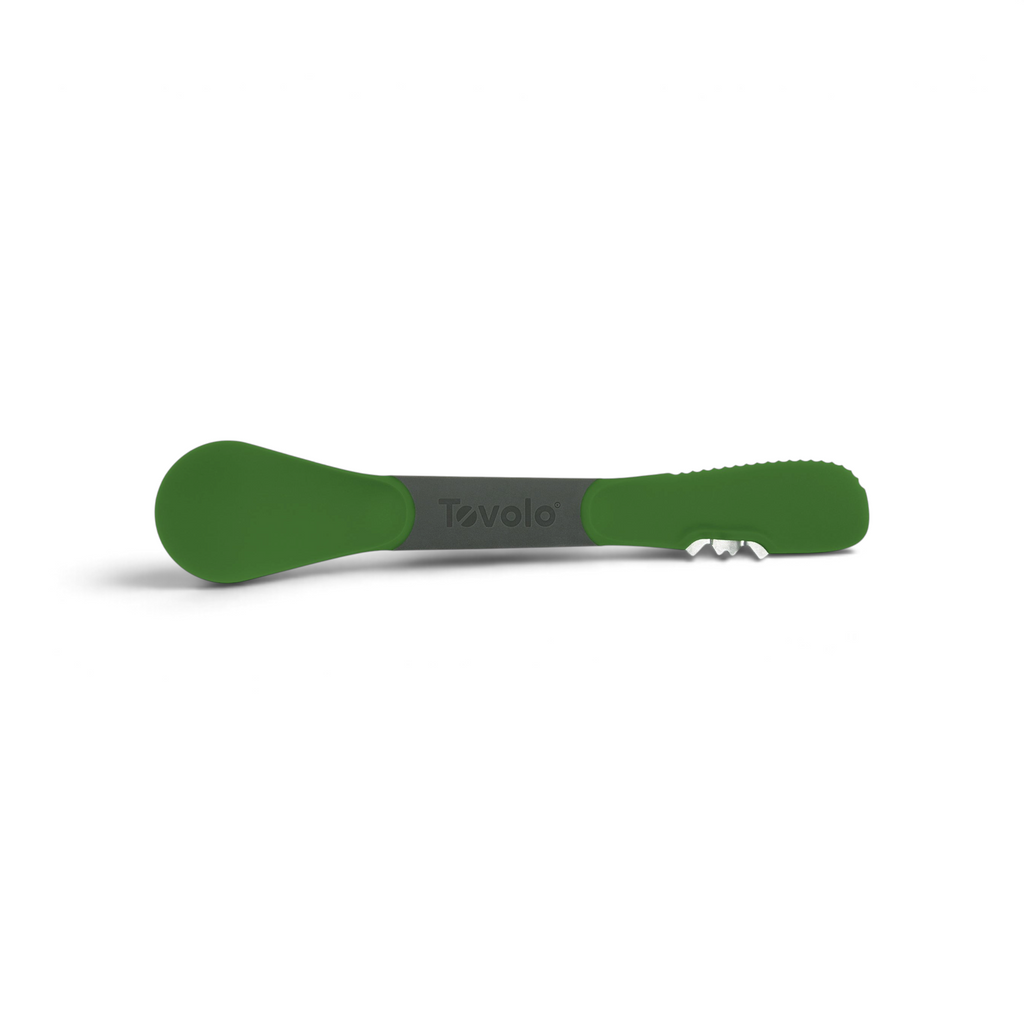 The 3-in-1 Avocado Tool features a green and gray design, textured handle, rounded spoon end, and a small metal blade. "Tovolo" is printed at the center.