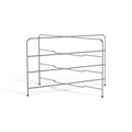 The Stack N Cool Baking Sheet Rack features three horizontal metal shelves in a zigzag design, supported by four legs with black rubber caps. Its open, minimalist style offers compact storage or cooling for trays, pans, and bakeware.
