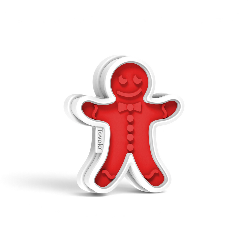 The Gingerbread Cookie Cutters feature a red design with white edges, a smiling face, bow tie, and button details—ideal for Christmas cookies. "Tovolo" is printed on the left side for a festive touch.