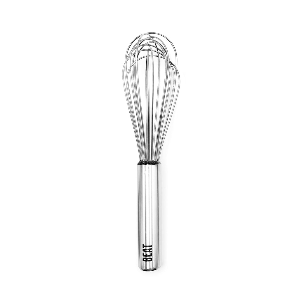 The Beat Whisk is a stainless steel kitchen utensil featuring a cylindrical handle engraved with "BEAT" at its base. Photographed on a white background, this durable whisk is dishwasher-safe for effortless cleaning.