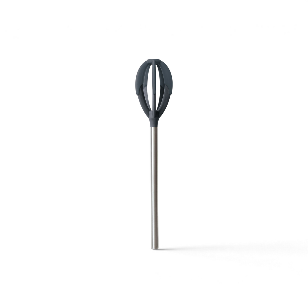 The Better Batter Tool is a heat-resistant spatula featuring a long stainless steel handle and a dark gray, rounded silicone head, ideal for stirring or whisking ingredients.