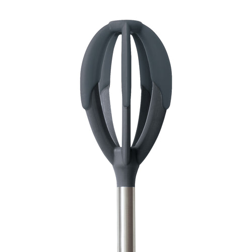 A close-up of the Better Batter Tool—a modern whisk with dark gray, oval silicone blades and a stainless steel handle—appears against a white background, ideal for mixing batters.