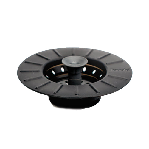 The Collapsible Stopper & Strainer is a black, circular sink drain stopper with a raised center knob and multiple holes around the inner ring, shown against a white background.