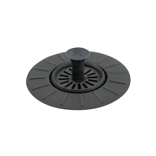 A Collapsible Stopper & Strainer in round black silicone, featuring a central handle and slotted drain holes, is shown against a white background.